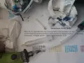Narzędzia do automatycznego czyszczenia drukarki Brother: strzykawka, papierowe ręczniki z atramentem i instrukcja "Sprawdzenie Jakości druku".