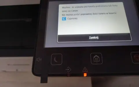 Na ekranie drukarki Canon MF645cx komunikat o nieoryginalnej kasecie z tonerem cyjanowym.